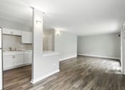 Thumbnail 20 of 45 - A kitchen with white cabinets and a refrigerator.