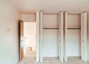 Thumbnail 21 of 29 - A room with a white door and a white wall.