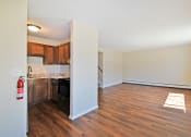 Thumbnail 1 of 29 - a renovated living room and kitchen with wood flooring