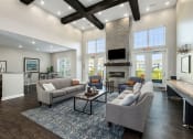 Thumbnail 11 of 23 - a spacious living room with couches and a fireplace