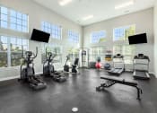 Thumbnail 16 of 23 - the gym has plenty of exercise equipment and windows