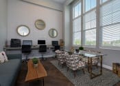 Thumbnail 4 of 27 - a living room with a couch and chairs and a table with chairs