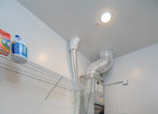 Thumbnail 27 of 27 - a laundry room with two washes and a dryer