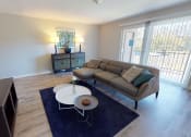 Thumbnail 17 of 46 - a living room with a couch and a table