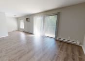 Thumbnail 45 of 46 - the living room and dining room of an empty house with wood flooring