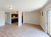 Thumbnail 43 of 46 - the living room and kitchen of an empty house with wood flooring