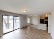 Thumbnail 46 of 46 - an empty living room with a sliding glass door to a balcony