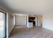 Thumbnail 40 of 46 - a living room and dining room with a wood floor