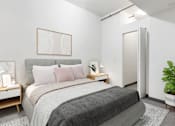 Thumbnail 20 of 29 - a bedroom with a bed and a closet