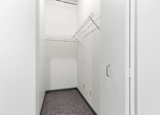 Thumbnail 27 of 29 - an empty room with white walls and a white closet