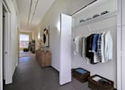 Thumbnail 29 of 29 - the walk in closet in the master bedroom is filled with closets and a wardrobe