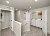 Thumbnail 22 of 32 - Laundry room with washer and dryer.