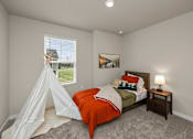 Thumbnail 16 of 32 - A bedroom with a bed, a teepee, and a painting on the wall.