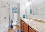 Thumbnail 9 of 26 - a bathroom with a sink toilet and a bath tub