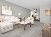 Thumbnail 4 of 26 - a living room with white couches and a coffee table