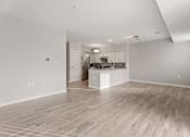 Thumbnail 40 of 43 - A spacious kitchen with a bar counter and a dining area.