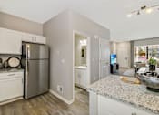 Thumbnail 3 of 43 - a kitchen with stainless steel appliances and granite counter tops