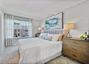 Thumbnail 5 of 43 - a bedroom with a bed and a window