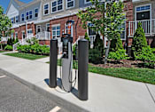Thumbnail 34 of 43 - a pair of charging stations in front of a building