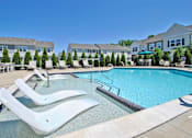 Thumbnail 29 of 43 - our apartments have a resort style pool with chaise lounge chairs