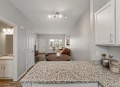 Thumbnail 5 of 47 - A spacious kitchen with a dining area and a living room.