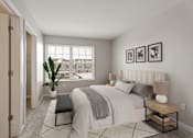 Thumbnail 6 of 47 - A bedroom with a large bed, a bench, and pictures on the wall.