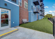 Thumbnail 41 of 41 - our apartments have an outdoor patio with a lawn and a brick building