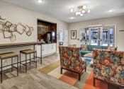 Thumbnail 31 of 41 - a living room with furniture and a bar with stools