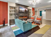 Thumbnail 30 of 41 - a living room with couches and chairs and a fireplace