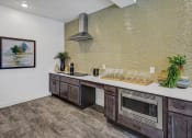 Thumbnail 33 of 41 - a kitchen with a counter top and a microwave