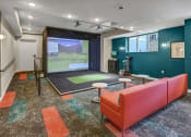 Thumbnail 22 of 41 - a workout room with a ping pong table and a window overlooking a golf course