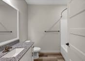 Thumbnail 17 of 41 - a bathroom with a sink and a toilet and a shower