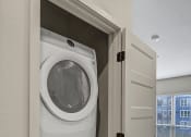 Thumbnail 19 of 41 - a washer and dryer in a closet in a home