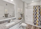 Thumbnail 14 of 41 - a bathroom with a sink and a shower and a toilet