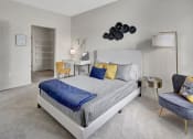 Thumbnail 9 of 41 - a bedroom with a bed and a desk and a chair