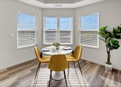 Thumbnail 6 of 41 - an image of a dining room with a table and chairs