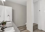 Thumbnail 15 of 41 - a bathroom with a sink and a toilet and a shower
