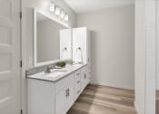 Thumbnail 16 of 41 - the preserve at ballantyne commons apartments bathroom with sink and mirror