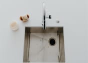 Thumbnail 11 of 43 - a sink with a faucet and soap on the side of it