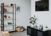 Thumbnail 20 of 43 - a living room filled with furniture and a flat screen tv