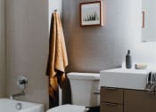 Thumbnail 30 of 43 - a bathroom with a toilet sink and bathtub