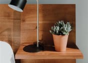 Thumbnail 27 of 43 - a lamp sitting on top of a wooden table