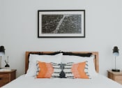 Thumbnail 26 of 43 - a bedroom with a bed and two night stands