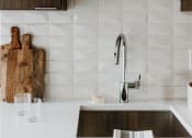 Thumbnail 6 of 43 - a kitchen sink with a glass shelf above it