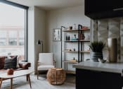 Thumbnail 17 of 43 - a living room with a bookshelf and a couch