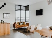 Thumbnail 38 of 43 - a living room filled with furniture and a flat screen tv