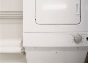 Thumbnail 36 of 43 - a white washer and dryer in a room