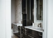 Thumbnail 28 of 43 - a bathroom with a sink and a toilet