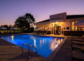 Thumbnail 42 of 43 - A pool with a building behind it.