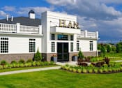 Thumbnail 41 of 43 - A white building with the word ELEAN on the front.
